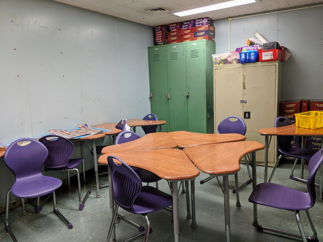 This tiny drab classroom could sure use some green air filtration.